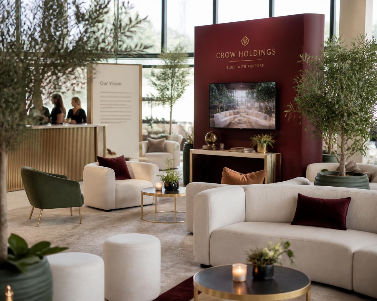 Modern corporate lounge activation in cream and burgundy